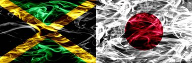 Jamaika vs Japonya, Japon bayrakları yan yana yerleştirilmiş duman. Kalın ipeksi duman bayrak Jamaika ve Japonya, Japonca, renkli