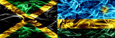 Jamaika vs Ruanda, İngiltere bayrakları yan yana yerleştirilmiş duman. Kalın ipeksi duman bayrak Jamaika ve Ruanda, Ruanda, renkli
