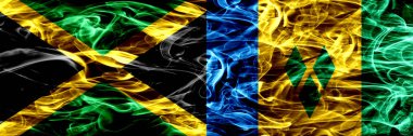 Jamaika vs Saint Vincent ve Grenadinler duman bayrakları yan yana yerleştirilmiş. Jamaika ve Saint Vincent ve Grenadinler ipeksi duman bayrakları renkli kalın