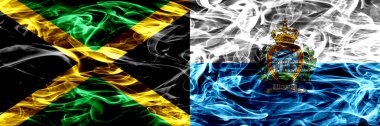 Jamaika vs San Marino, San Marino duman bayrakları yan yana yerleştirilmiş. Kalın ipeksi duman bayrak Jamaika ve San Marino, San Marino, renkli