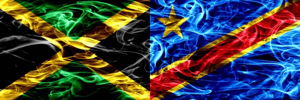 Jamaika – Kongo Demokratik Cumhuriyeti bayrakları yan yana yerleştirilmiş duman. Jamaika ve Kongo Demokratik Cumhuriyeti ipeksi duman bayrakları renkli kalın