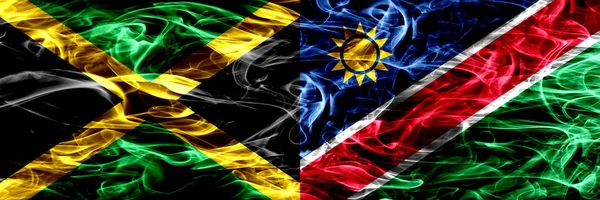 Ямайка Против Намибии Намибийские Дымовые Флаги Размещенные Бок Бок Толстые — стоковое фото