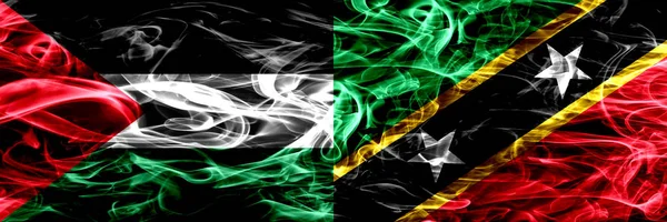 巴勒斯坦 圣基茨和尼维斯的烟雾旗并排放置 巴勒斯坦和圣基茨和尼维斯的浓色丝滑烟雾旗 — 图库照片