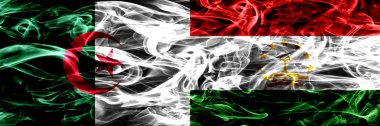 Cezayir, Cezayir vs Tacikistan, Tajikistani yan yana yerleştirilmiş bayrakları duman. Kavram ve fikir bayrakları mix