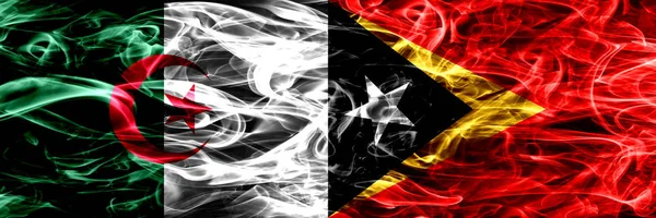 Алжир Алжир Против Восточного Тимора Флаги Дыма Помещены Бок Бок — стоковое фото