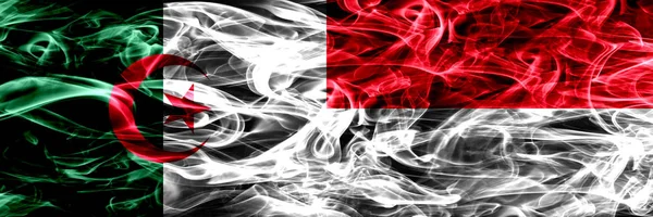 Cezayir, Cezayir vs Monaco, Monacan yan yana yerleştirilmiş bayrakları duman. Kavram ve fikir bayrakları mix