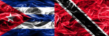 Küba, Küba vs Trinidad ve Tobago bayrakları yan yana yerleştirilmiş duman. Kavram ve fikir bayrakları mix