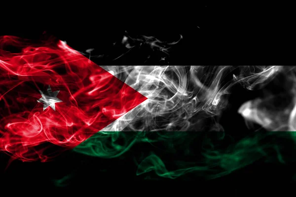 约旦国旗由黑色背景上的有色烟雾制成 抽象丝质波浪背景 — 图库照片