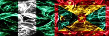 Nijerya, Nijerya vs Grenada bayrakları yan yana yerleştirilmiş duman. İpeksi duman bayrakları renkli kalın soyut