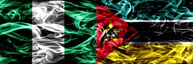 Nijerya, Nijerya vs Mozambik, Mozambik bayrakları yan yana yerleştirilmiş duman. İpeksi duman bayrakları renkli kalın soyut