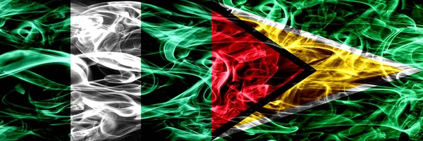 Нігерія Проти Нігерійських Гайана Гайанци Палити Прапори Розміщені Поруч Товсті — стокове фото