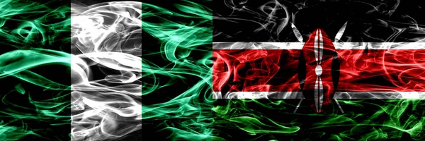 尼日利亚 尼日利亚 肯尼亚 肯尼亚的烟旗并排飘扬 厚重抽象的彩色丝质烟旗 — 图库照片