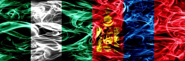 尼日利亚 尼日利亚对蒙古 蒙古烟旗并排飘扬 厚重抽象的彩色丝质烟旗 — 图库照片