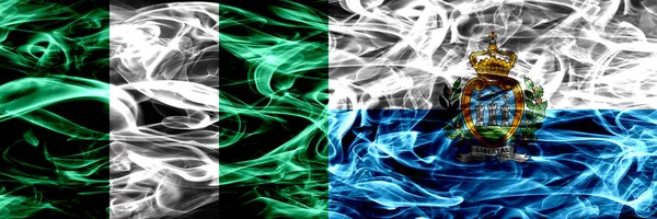 尼日利亚 尼日利亚 圣马力诺 萨摩亚烟旗并排飘扬 厚重抽象的彩色丝质烟旗 — 图库照片