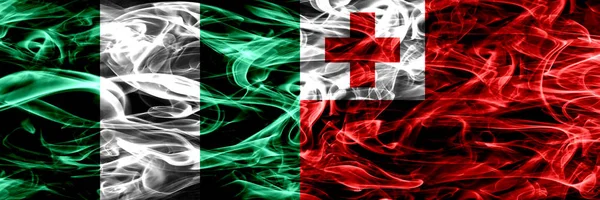 Nigeria Nigeria Tonga Banderas Humo Tonga Colocadas Una Lado Otra —  Fotos de Stock