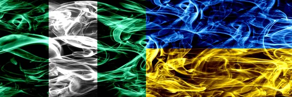 Nigeria Nigerian Ukraine Ukrainian Smoke Flags Placed Side Side Thick — Stock Photo, Image