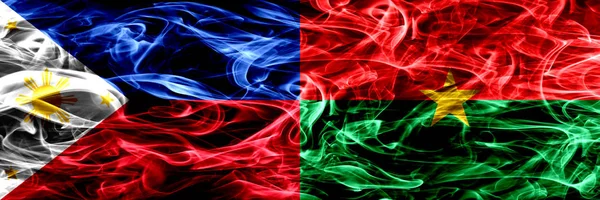 Филиппины Против Буркина Фасо Дымовые Флаги Размещены Бок Бок Толстые — стоковое фото