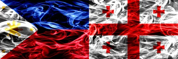 Филиппины Против Грузии Грузинские Дымовые Флаги Размещены Бок Бок Толстые — стоковое фото