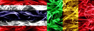 Tayland vs Mali duman bayrakları yan yana yerleştirilmiş. İpeksi duman bayrakları renkli kalın soyut