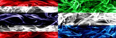 Tayland vs Sierra Leone duman bayrakları yan yana yerleştirilmiş. İpeksi duman bayrakları renkli kalın soyut