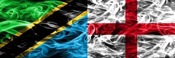 Tanzania vs England, English smoke flags placed side by side. Thick colored silky smoke flags of Tanzanian and England, English