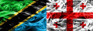 Tanzanya vs Georgia, Gürcü bayrakları yan yana yerleştirilmiş duman. Kalın ipeksi duman bayrak Tanzanya ve Georgia, Gürcüce, renkli