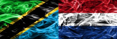 Tanzanya vs Hollanda, Hollanda bayrakları yan yana yerleştirilmiş duman. Kalın ipeksi duman bayrak Tanzanya ve Hollanda, Flamanca, renkli