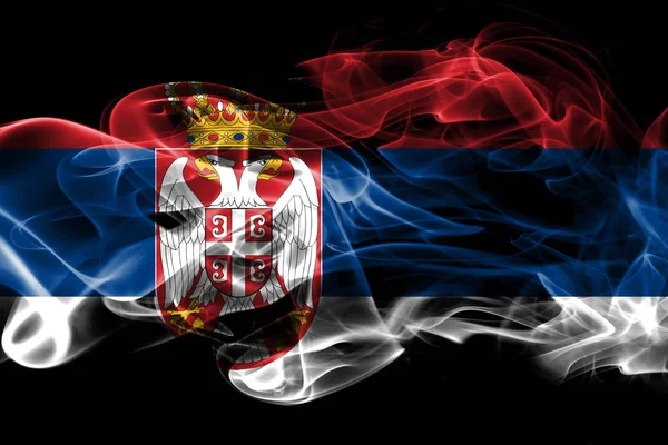黒の背景に分離された色付きの煙から作られたセルビアの国旗 — ストック写真