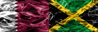Katar rakip Jamaika, Jamaika bayrakları yan yana yerleştirilmiş duman. Birleşik Arap Emirlikleri. Birleşik Arap Emirlikleri