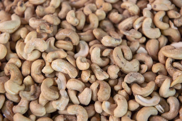 Rostade cashewnötter, textur och bakgrund. Topp-vy. — Stockfoto