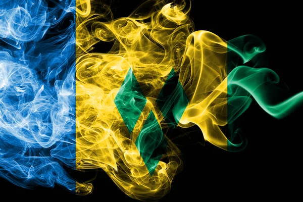 National flag of Saint Vincent and the Grenadines made from colored smoke isolated on black background. Abstract silky wave background. — Stock Photo, Image