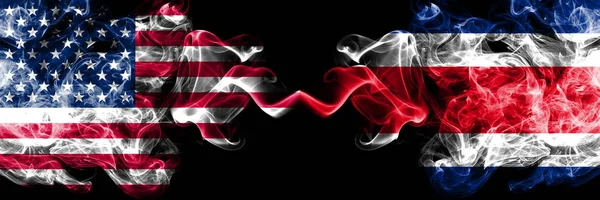 United States of America vs Costa Rica smoky mystic flags placed side by side. Thick colored silky smoke flags of America and Costa Rica — Stock Photo, Image