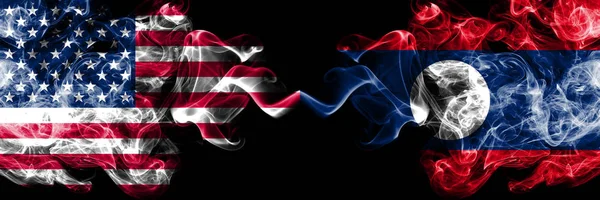 United States of America vs Laos smoky mystic flags placed side by side. Thick colored silky smoke flags of America and Laos — Stock Photo, Image