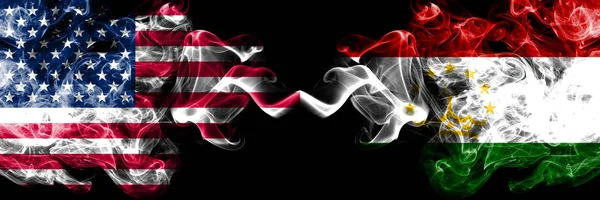 United States of America vs Tajikistan, Tajikistani smoky mystic flags placed side by side. Thick colored silky smoke flags of America and Tajikistan, Tajikistani — Stock Photo, Image