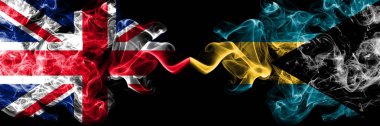 İngiltere vs Bahamalar, Bahama dumanlı mistik bayrakları yan yana yerleştirilmiş. Kalın ipeksi duman bayrak İngiltere ve Bahamalar, Bahama, renkli.