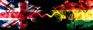 İngiltere vs Bolivya, Bolivya dumanlı mistik bayrakları yan yana yerleştirilmiş. Kalın ipeksi duman bayrak İngiltere ve Bolivya, Bolivya, renkli.