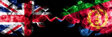 İngiltere vs Eritre dumanlı mistik bayrakları yan yana yerleştirilmiş. Büyük Britanya ve Eritre ipeksi duman bayrakları renkli kalın.