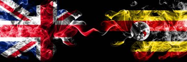 İngiltere vs Uganda, Uganda dumanlı mistik bayrakları yan yana yerleştirilmiş. İngiltere ve Uganda, Ugandalı ipeksi duman bayrakları kalın renkli.