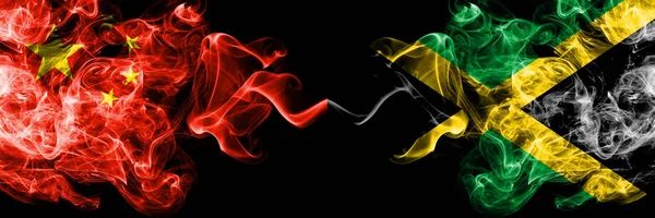 China vs Jamaica, Jamaican smoke flags placed side by side. Thick colored silky smoke flags of Chinese and Jamaica, Jamaican — Stock Photo, Image