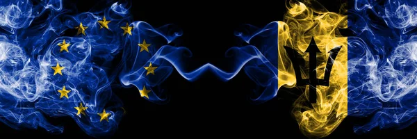 Europeiska unionen vs Barbados, bar Badian rök flaggor placeras sida vid sida. Tjocka färgade silkes len rök flaggor i EU och Barbados, Barbadian — Stockfoto