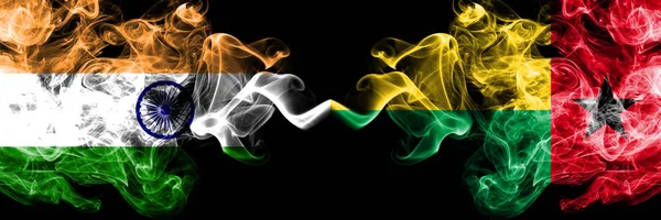 India vs Guinea Bissau smoke flags placed side by side. Thick colored silky smoke flags of Indian and Guinea Bissau — Stock Photo, Image