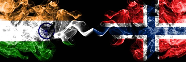 India vs Norway, Norwegian smoke flags placed side by side. Thick colored silky smoke flags of Indian and Norway, Norwegian