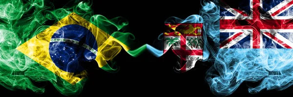 Brazil vs Fiji smoke flags placed side by side. Thick colored silky smoke flags of Brazilian and Fiji — Stock Photo, Image