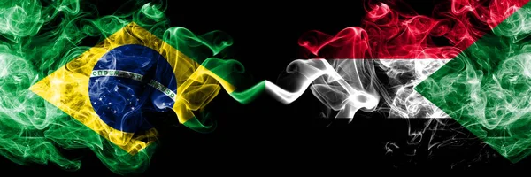 Brazil vs Sudan, Sudanese smoke flags placed side by side. Thick colored silky smoke flags of Brazilian and Sudan, Sudanese — Stock Photo, Image