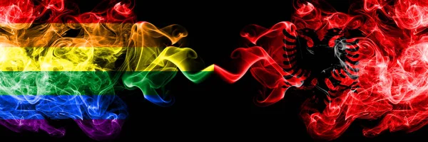 同性恋对阿尔巴尼亚, 阿尔巴尼亚烟旗并排放置。浓重的彩色丝质烟旗骄傲和阿尔巴尼亚, 阿尔巴尼亚 — 图库照片