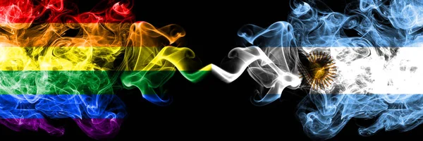 Gay vs Argentina, argentinska rök flaggor placeras sida vid sida. Tjocka färgade silkes len rök flaggor av Pride och Argentina, argentinska — Stockfoto