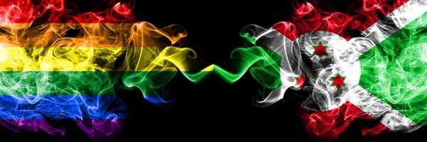 Gay vs Burundi, Burundian smoke flags placed side by side. Thick colored silky smoke flags of Pride and Burundi, Burundian — Stock Photo, Image