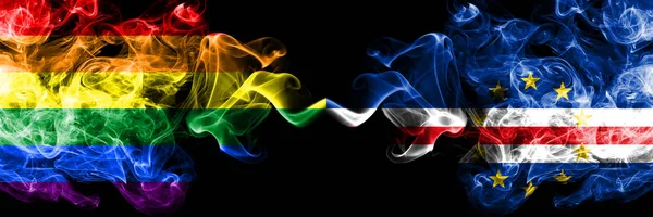 Gay vs Cape Verde smoke flags placed side by side. Thick colored silky smoke flags of Pride and Cape Verde — Stock Photo, Image