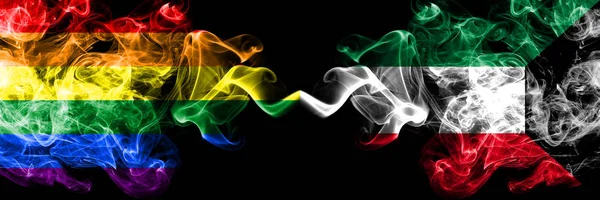 Gay vs Kuwait, Kuwaiti rök flaggor placeras sida vid sida. Tjocka färgade silkes len rök flaggor av Pride och Kuwait, Kuwaiti — Stockfoto