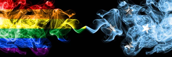 Gay vs Micronesia, banderas de humo micronesianas colocadas una al lado de la otra. Banderas de humo sedoso de color grueso de Orgullo y Micronesia, Micronesia —  Fotos de Stock